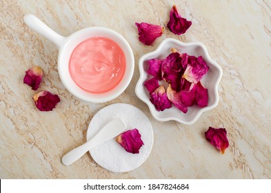 Two Small Porcelain Bowls With Rose Jelly Face Mask And Dry Rose Petals. Natural Skin Care, Homemade Spa, Beauty Treatment Recipe. Flat Lay