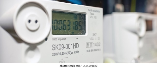 Two smart electric power meter counter measuring power usage.Banner,advertisement.Close-up of modern smart grid residential digital power supply meter.Indoors shot.Selective focus.