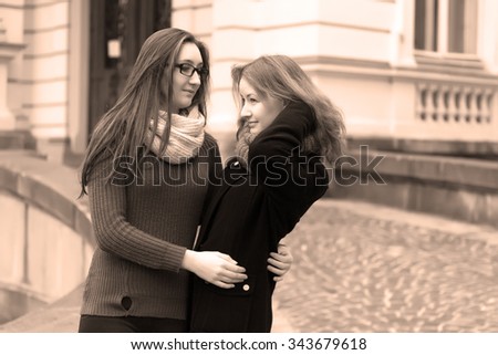 Similar – Image, Stock Photo two sisters laugh heartily on the street