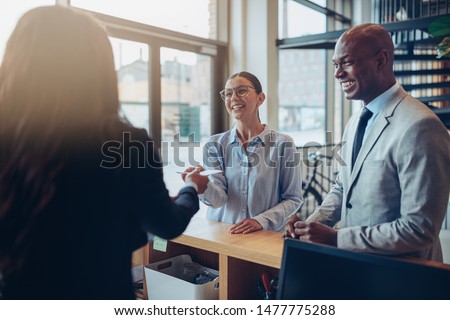 Similar – Image, Stock Photo Young woman in hotel corridor