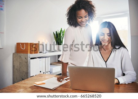 Similar – Young entrepreneur working at night in home office