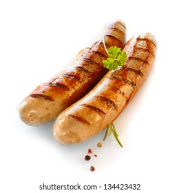 Two smoked sausage against the white background