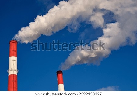 Two smoking chimneys of a powerplant