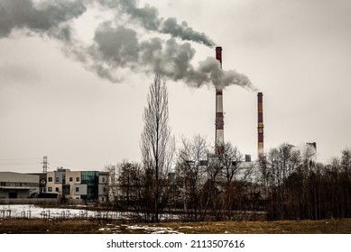 Two smoking factory pipes. industrial and environment pollution theme