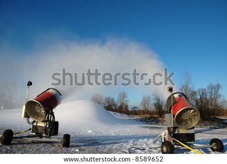 two snowmaker at work
