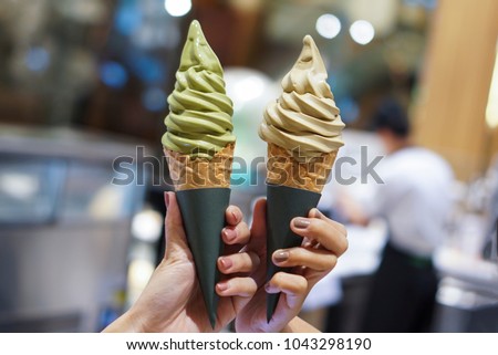 Two soft serve ice cream cone with premium matcha green tea and hojicha.