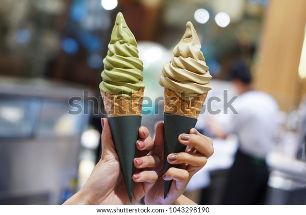 Two soft serve ice cream cone with premium\
matcha green tea and\
hojicha.