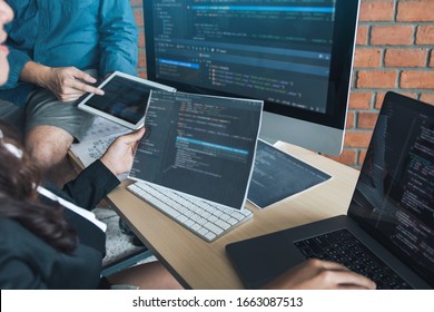 Two software developers are analyzing together about the code written into the program on the computer.