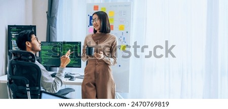 Two software developers engage in a discussion at coffee break time in a modern office, relax emotion