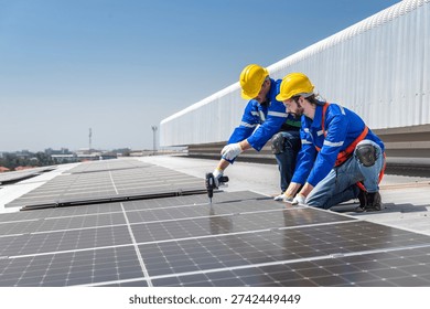 Two solar panel workers installing solar panels on a roof.
