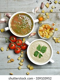 Two Soup Bowls Composition Vegetarian Mushroom And Fish Cream Soup In Bowl With Garlic Parsley Dill And Croutons On Rustic Wood Background