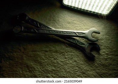 Two Spanners Made Of Chrome Vanadium Steel On A Soft Surface Close To The Source Of Light. Background Picture.