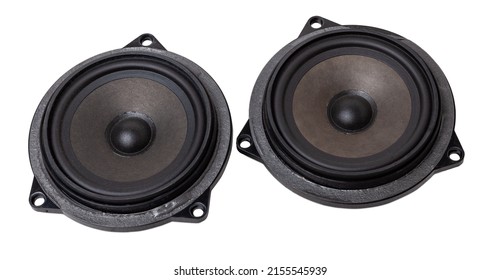 Two speakers of an acoustic system - an audio for playing music in a car interior on a white isolated background in a photo studio. Spare parts for auto repair in a workshop or for sale for tuning