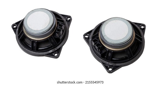 Two speakers of an acoustic system - an audio for playing music in a car interior on a white isolated background in a photo studio. Spare parts for auto repair in a workshop or for sale for tuning