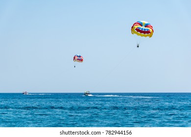 Two Speed Boats With People Flying On Parasailing Parachute (RHODES, GREECE)