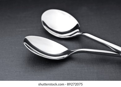 Two Spoons On A Slate Plate