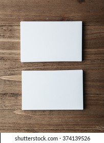 Two Stack Of Blank White Business Cards On Wooden Background Vertical