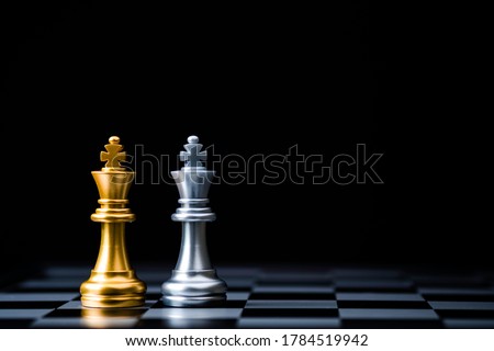Two Stand of golden and silver king chess . Winner of business alliance and marketing strategy planing concept.