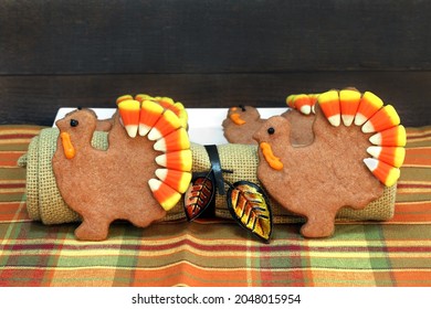 Two Standing Turkey Shaped Sugar Cookies With Candy Corn As The Turkey's Tail.  Close Up With Copy Space.