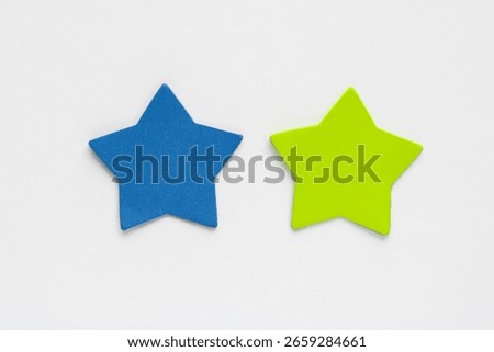 Two star shaped sticky notes or cutouts on a clean background.