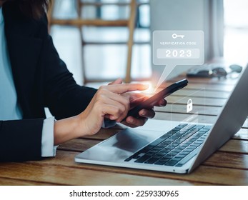 Two steps authentication (2FA) concept. 2023, Verification code and key icon alert on smart phone while using computer for validate password web page, Identity verification, cyber security technology.