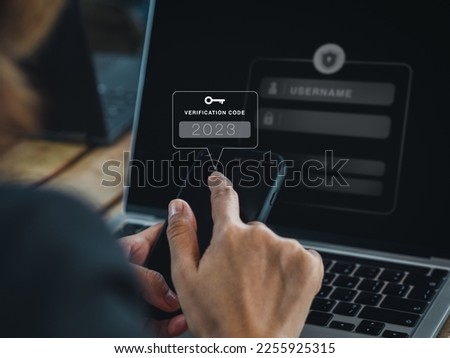 Two steps authentication (2FA) concept. 2023, Verification code and key icon alert on smart phone while using computer for validate password page, Identity verification, cyber security technology.