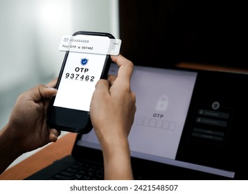 Two steps authentication concept. OTP code showing on phone screen for log in on web on laptop, validate password, Identity verification, cybersecurity with security code authentication technology.