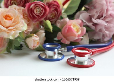 Two Stethoscopes Flowers On White Background Stock Photo 1666571959