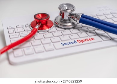 Two Stethoscopes on keyboard with second opinion text, healthcare advice and review concept.
