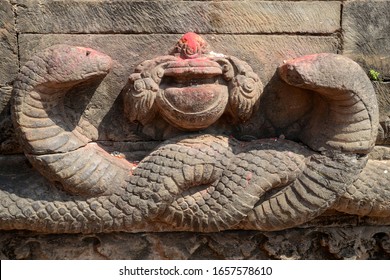 Two Stone Snakes Facing Each Other (almost Like Tulsa Doom Symbol From Conan Barbarian). Decoration Element Of The Medieval Hindu Temple. Durbar Square Bhaktapur, Nepal.