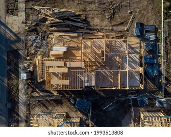 A Two Storey House Being Built In A New Estate In Melbourne Australia, Frame For The First Stage Erected And All Of The Remaining Timber Sits In Piles For The Second Floor And Roof To Be Built.