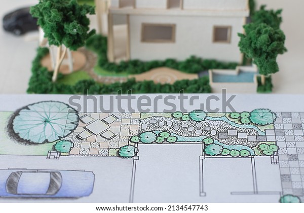 the two storey single
house 3D house mass model and layout plan of home landscape design
or garden design or landscape architecture color drawing by hand,
selective focus