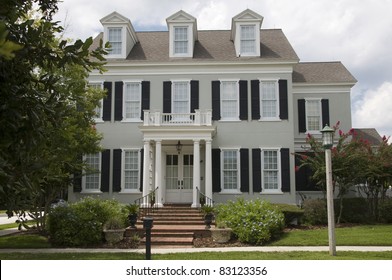 Two Story Colonial Style Home With Shutters