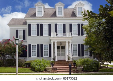 Two Story Colonial Style Home With Shutters