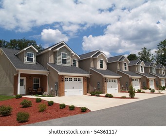 Two Story Low Income Retirement Homes With The Garage In The Front.