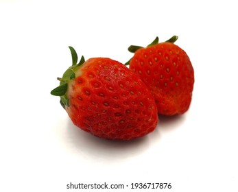 Two strawberries isolated on white background - Shutterstock ID 1936717876