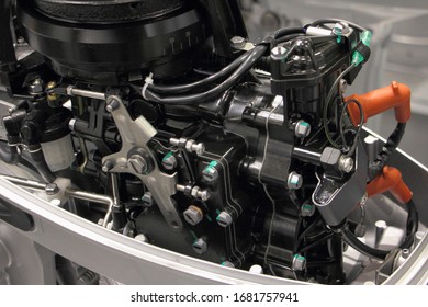Two stroke outboard boat motor without cap cover close up