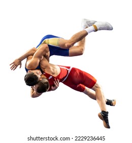 Two  strong men in blue and red wrestling tights are wrestling and making a suplex wrestling on a white background. Wrestlers doing grapple. 