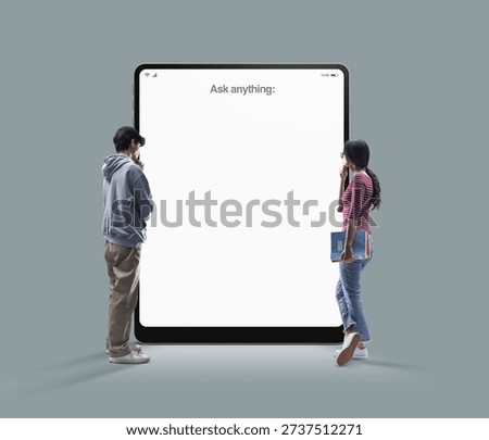 Two students interacting with a giant tablet displaying an AI assistant interface, symbolizing digital education, technology, knowledge access and modern learning innovation.