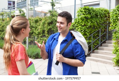 Two Students Talking On Campus