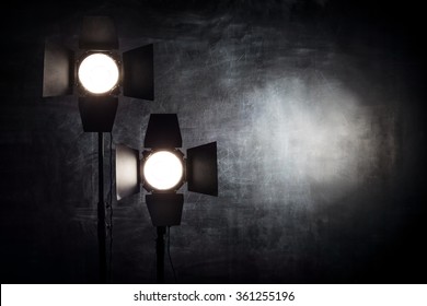 Two Studio Light Source With Reflectors Are On The Chalk Board Background