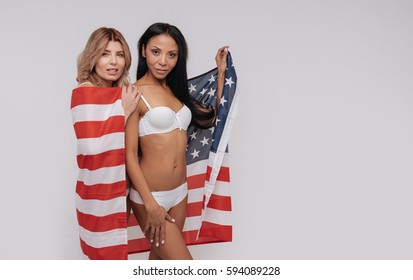 Two stunning models posing together on set