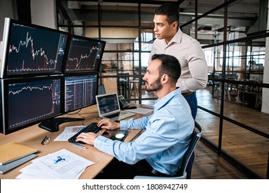 Two Successful Trader In Formalwear Working Together In Office, Looking At Screen, Checking Global Currency Index On Fund Exchange