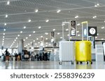 Two suitcases in an empty airport hall, traveler cases in the departure airport terminal waiting for the area, vacation concept, blank space for text message or design, luggage for travel vacation.