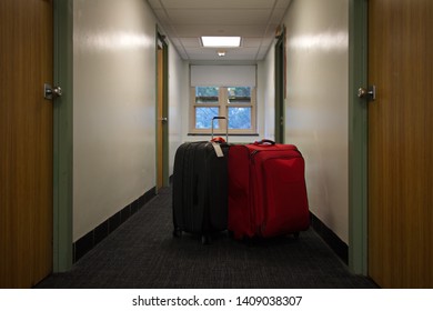 Two Suitcases Waiting Outside In The Dorm Hallway On Move Out Day