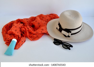 Two summer hat, baseball cap and sunglasses on a white background. Space for text.