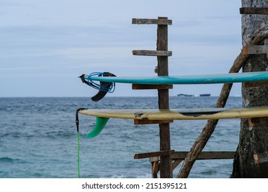 Two Surf Boards By The Coconut Tree In Cloud 9 Siargao Philippines.