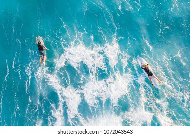 Two Surfers In The Ocean, Top View