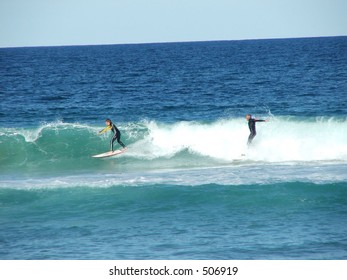two surfers one wave