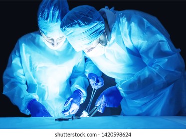 Two Surgeons, A Man And A Woman, Perform Surgery To Remove Prostate Adenoma And Varicocele, Fibroadenoma